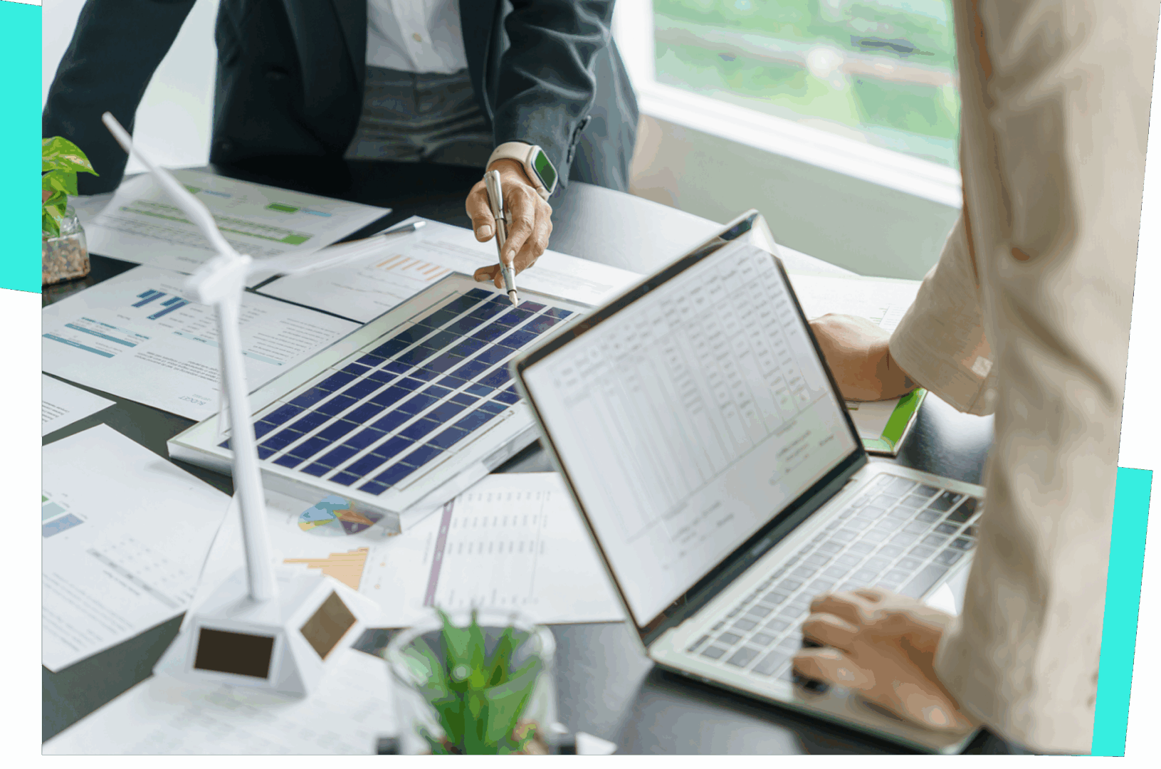 People discussing solar panel project at desk.